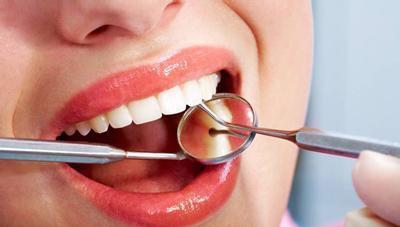 大牙上的 小黑点 是什么 什么情况下补牙最合适 早知或早受益