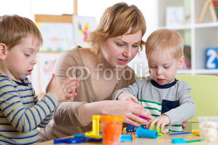 8105025853 woman teaches kids handcraft at kindergarten or playschool 